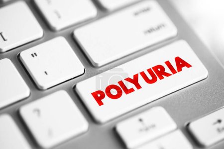 Foto de La poliuria es excesiva o una producción anormalmente grande o pasaje de orina, botón de concepto de texto en el teclado - Imagen libre de derechos