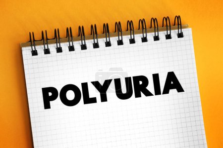 Foto de La poliuria es excesiva o una producción anormalmente grande o el paso de orina, texto en el bloc de notas - Imagen libre de derechos