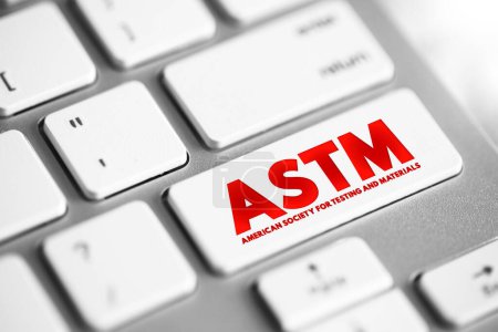 Téléchargez les photos : ASTM - American Society for Testing and Materials est un organisme international de normalisation, bouton de concept de texte sur le clavier - en image libre de droit
