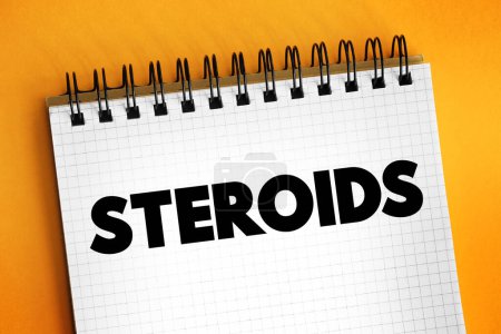 Photo for Steroids is a biologically active organic compound with four rings arranged in a specific molecular configuration, text concept on notepad - Royalty Free Image
