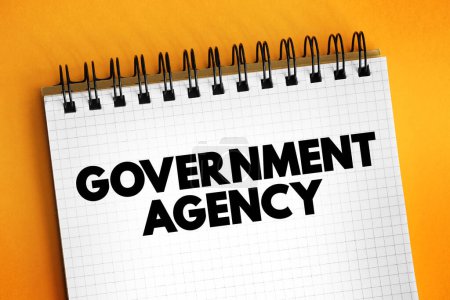 Foto de Agencia Gubernamental - establecida por un gobierno nacional o estatal dentro de un sistema federal, concepto de texto en el bloc de notas - Imagen libre de derechos