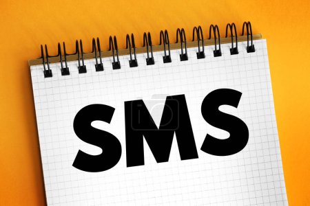 SMS (Short Message Service) - text messaging service component of most telephone, Internet and mobile device systems, text concept on notepad