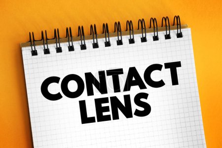 Contact lens - thin lenses placed directly on the surface of the eyes, text concept on notepad