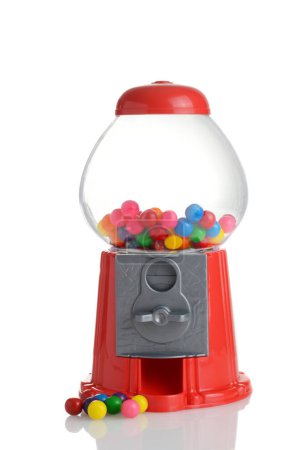 Foto de Máquina de goma de juguete de plástico con goma de mascar de colores - Imagen libre de derechos