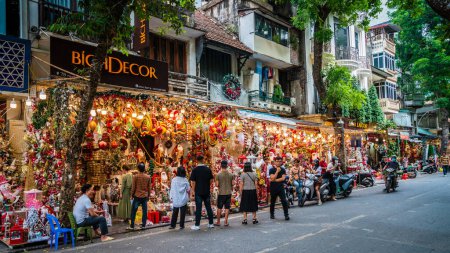 Photo for Hanoi, Vietnam, November 14, 2022: Brightly lit display of a Christmas store in French Quarter in Hanoi, Vietnam - Royalty Free Image