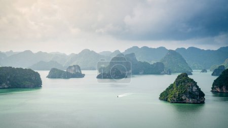 Photo for Beautiful limestone karst islands of Ha Long Bay in Vietnam. View from Ti-Top Island - Royalty Free Image