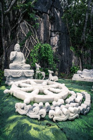 Photo for Ornamental garden with a Buddha statue and marble decorations on the Marble Mountain in Vietnam - Royalty Free Image
