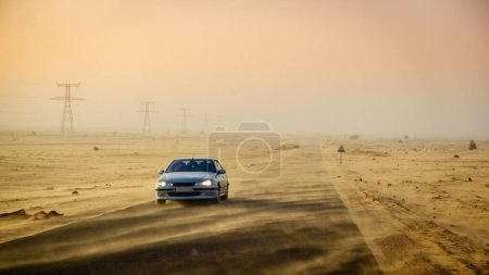 Photo for Sand blowing across the road in the desert in Mauritania - Royalty Free Image