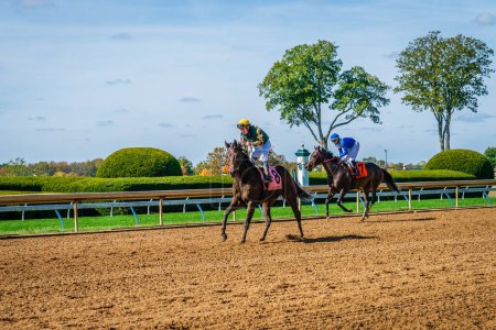 Photo for Keeneland, Lexington, Kentucky, October 18, 2023: Keenealand Fall Race Meet event, horses are coming back after finishing Race 1 - Royalty Free Image