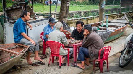 Photo for Hoi An, Vietnam, November 20, 2022: Men are playing Co Tuong or Vietnamese Chess in Hoi An, Vietnam - Royalty Free Image