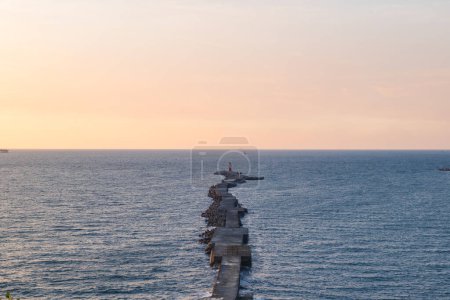Photo for Lighthouse on the end of walkway at Cijin island,  Kaohsiung, Taiwan - Royalty Free Image