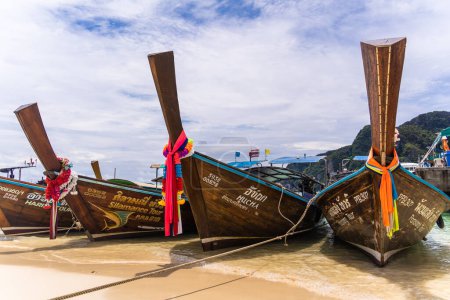 Photo for KRABI, THAILAND - OCTOBER 09, 2022: Traditional Thai boats on the ocean beach - Royalty Free Image