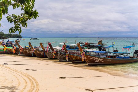 Photo for KRABI, THAILAND - OCTOBER 09, 2022: Traditional Thai boats on the ocean beach - Royalty Free Image