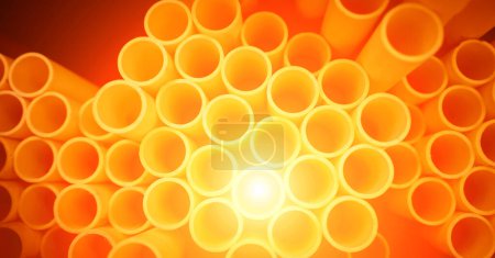 Photo for Background of the orange plastic pipes in stacked. - Royalty Free Image