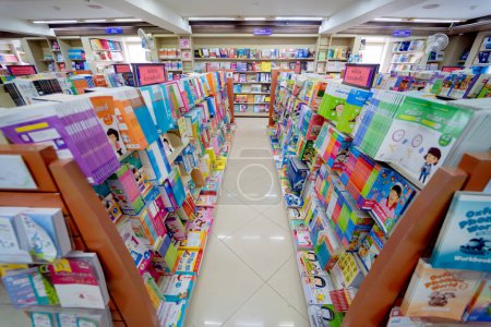 Photo for Different books lying on the shelves in the book store. - Royalty Free Image