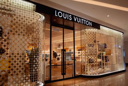 Photo for KUALA LUMPUR, MALAYSIA - DECEMBER 04, 2022: Louis Vuitton brand retail shop logo signboard on the storefront in the shopping mall. - Royalty Free Image