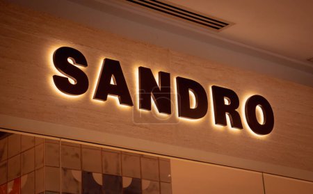 Photo for KUALA LUMPUR, MALAYSIA - DECEMBER 04, 2022: Sandro brand retail shop logo signboard on the storefront in the shopping mall. - Royalty Free Image