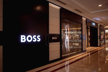 Photo for KUALA LUMPUR, MALAYSIA - DECEMBER 04, 2022: Hugo Boss brand retail shop logo signboard on the storefront in the shopping mall. - Royalty Free Image