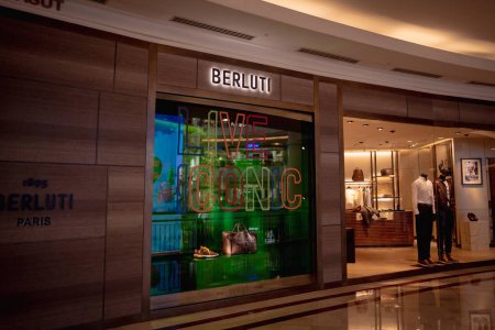 Photo for KUALA LUMPUR, MALAYSIA - DECEMBER 04, 2022: Berluti brand retail shop logo signboard on the storefront in the shopping mall. - Royalty Free Image