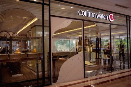 Foto de KUALA LUMPUR, MALAYSIA - DECEMBER 04, 2022: Cortina watch brand retail shop logo signboard on the storefront in the shopping mall. - Imagen libre de derechos