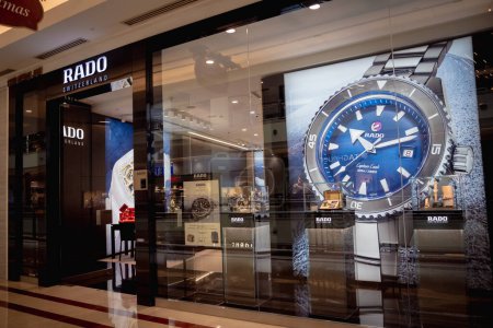 Photo for KUALA LUMPUR, MALAYSIA - DECEMBER 04, 2022: Rado brand retail shop logo signboard on the storefront in the shopping mall. - Royalty Free Image