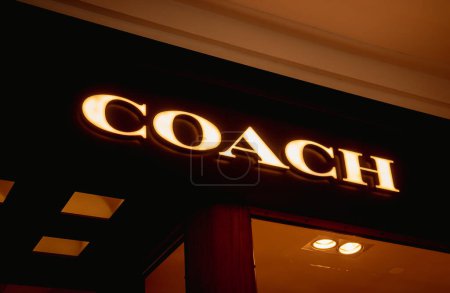 Photo for KUALA LUMPUR, MALAYSIA - DECEMBER 04, 2022: Coach brand retail shop logo signboard on the storefront in the shopping mall. - Royalty Free Image