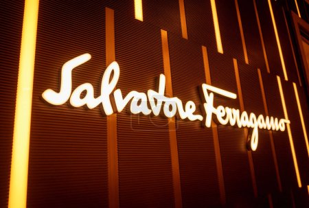 Téléchargez les photos : KUALA LUMPUR, MALAYSIA - DECEMBER 04, 2022: Salvatore Ferragamo brand retail shop logo signboard on the storefront in the shopping mall. - en image libre de droit