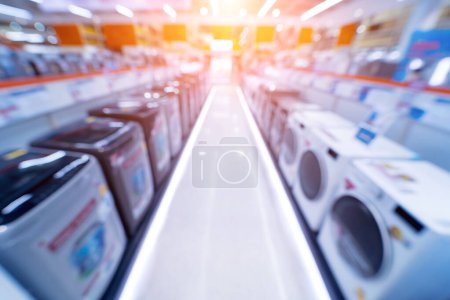 Téléchargez les photos : Blurred background of large household appliances and furniture store. - en image libre de droit