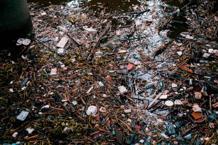 Photo for Waterway clogged with plastic pollution and other garbage. - Royalty Free Image