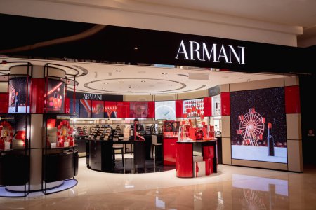 Photo for KUALA LUMPUR, MALAYSIA - DECEMBER 04, 2022: Armani brand retail shop logo signboard on the storefront in the shopping mall. - Royalty Free Image