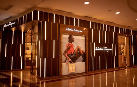 Photo for KUALA LUMPUR, MALAYSIA - DECEMBER 04, 2022: Salvatore Ferragamo brand retail shop logo signboard on the storefront in the shopping mall. - Royalty Free Image