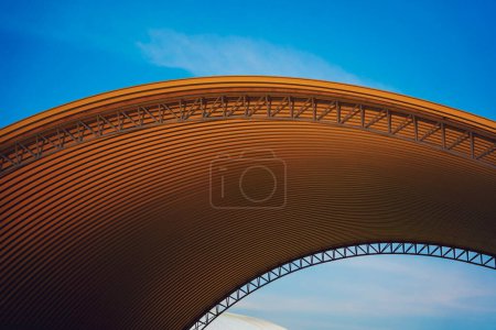 Photo for Abstract background spiral metal arch on blue sky. - Royalty Free Image