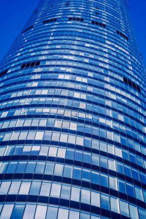 Photo for Modern building with glass facade at the clear sky background. - Royalty Free Image