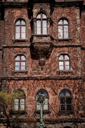 Photo for Facade of a old european historical building with vintage windows and doors. - Royalty Free Image