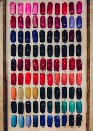 Photo for Different nails samples on the whiteboard at beauty salon. - Royalty Free Image