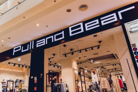 Photo for WARSAW. POLAND - MAY 21, 2023: Pull and Bear brand retail shop logo signboard on the storefront in the shopping mall. - Royalty Free Image