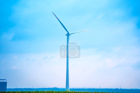 Photo for Windmill farm at the fields with beautiful blue sky. - Royalty Free Image