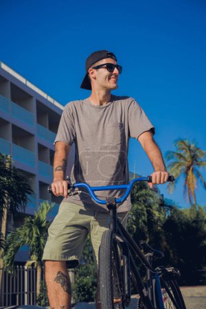 Photo for Happy young man enjoy BMX riding at the skatepark. - Royalty Free Image