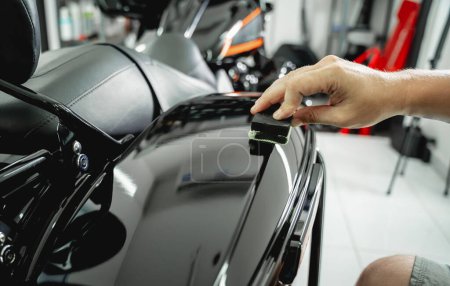 Photo for The process of nano coating motorcycle applying soft fiber sponge. - Royalty Free Image