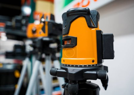 Photo for The new theodolite on a tripod at the shop. - Royalty Free Image