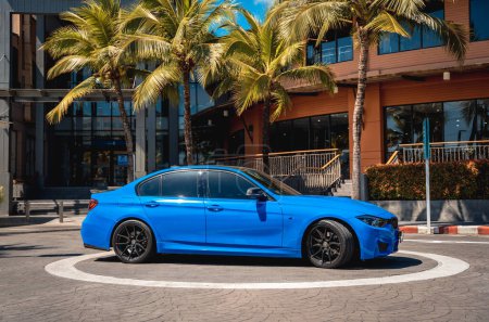 Photo for PHUKET, THAILAND- DECEMBER 25, 2023: Beautiful bright blue BMW M3 series in the parking lot - Royalty Free Image