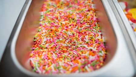 Photo for Sugar sprinkle for making handmade chocolates and candies in a workshop. - Royalty Free Image