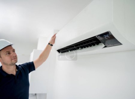 Photo for Technician cleans air conditioner system in a modern apartment - Royalty Free Image