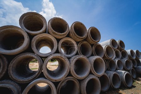Photo for A stack of concrete ring pipes piled and creating a symmetrical arrangement. - Royalty Free Image