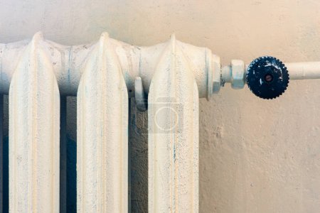 Photo for Painted cast iron heater old classic heating system close-up - Royalty Free Image