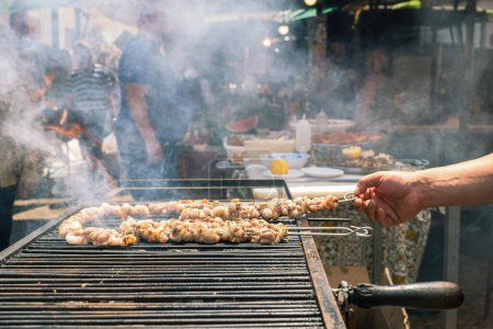 Photo for Stigghiole famous grilled street food, Ballaro market in Palermo - Royalty Free Image