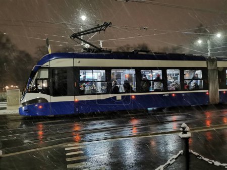 Photo for Krakow, Poland - December 1st 2023 - modern tram in Krakow christmas night - Royalty Free Image