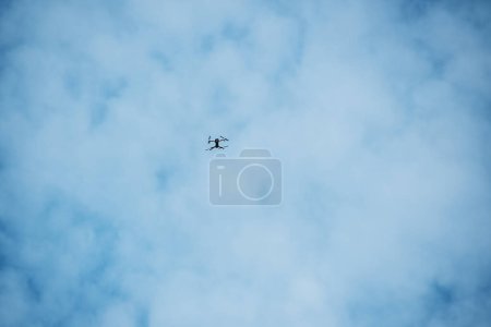 Photo for The drone takes pictures in a blue sky with white clouds. - Royalty Free Image