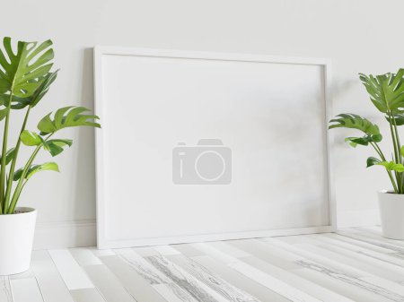 Foto de Marco blanco apoyado en el suelo en el interior con las plantas maqueta. Plantilla de una imagen enmarcada en una representación 3D de pared - Imagen libre de derechos