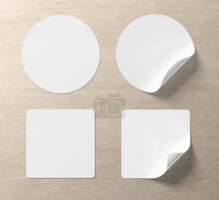 Téléchargez les photos : Blank sticker mockup with curled corner isolated on wood background. Circular and squared adhesive label with bent side. 3D rendering - en image libre de droit